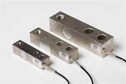A group of three stainless steel blocks with wires attached to them.