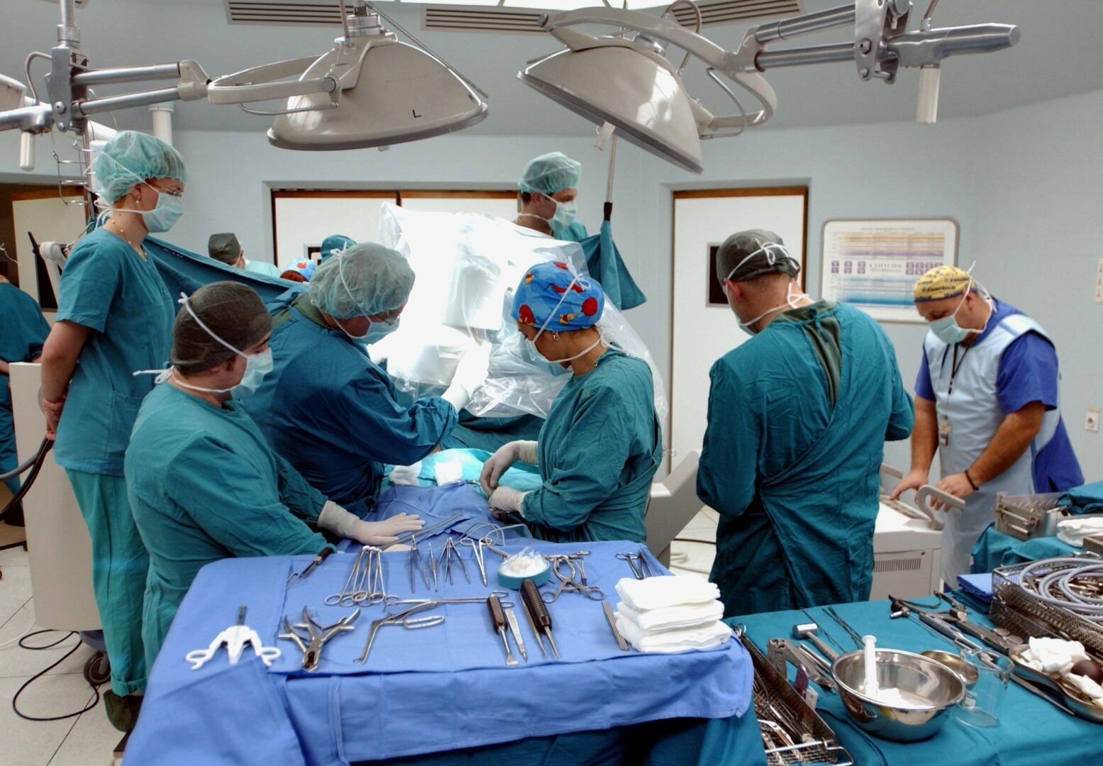 A group of surgeons in the operating room.
